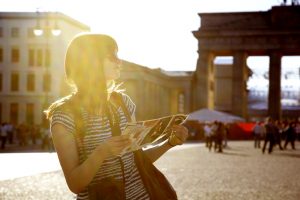 Girl with map at Brandenburger Tor