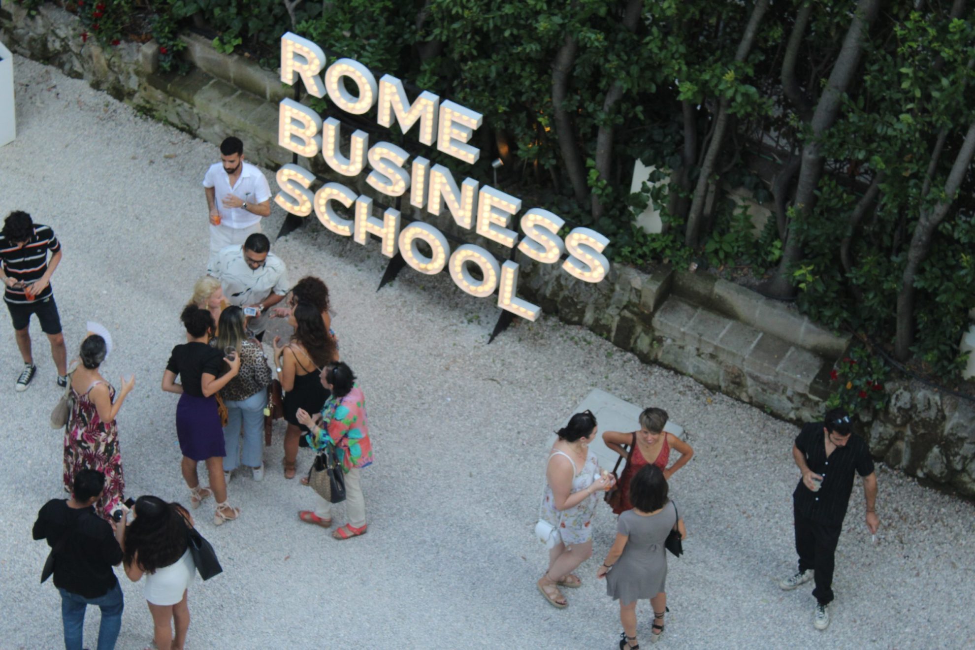 rome business school students networking on campus