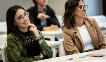 international management students smiling on campus