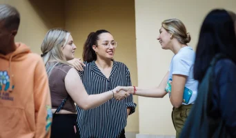 master in hr students shaking hands